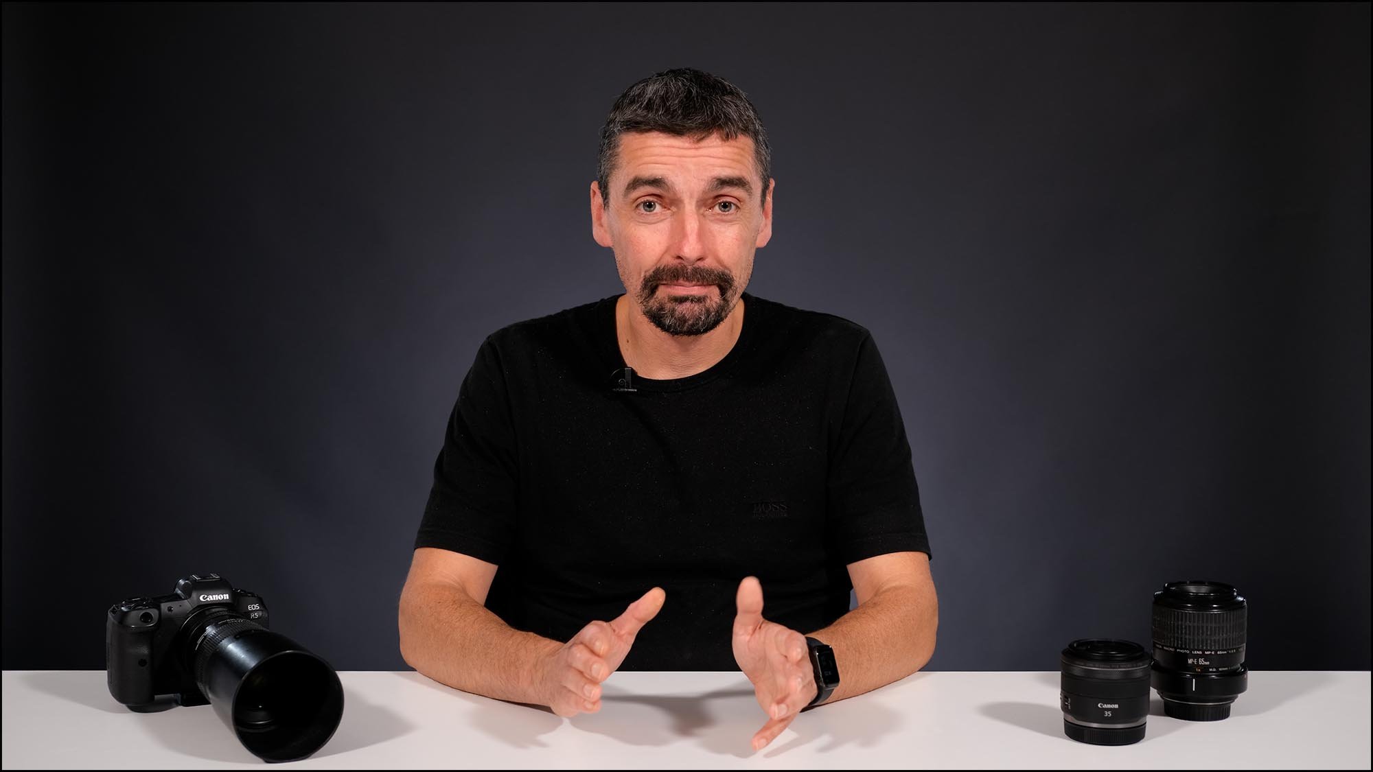 Oliver Wright in studio with camera and macro lenses