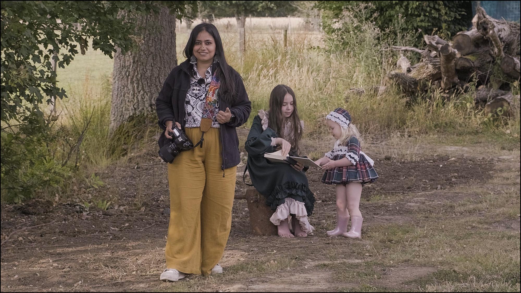 Photographer with children setting up for a portrait