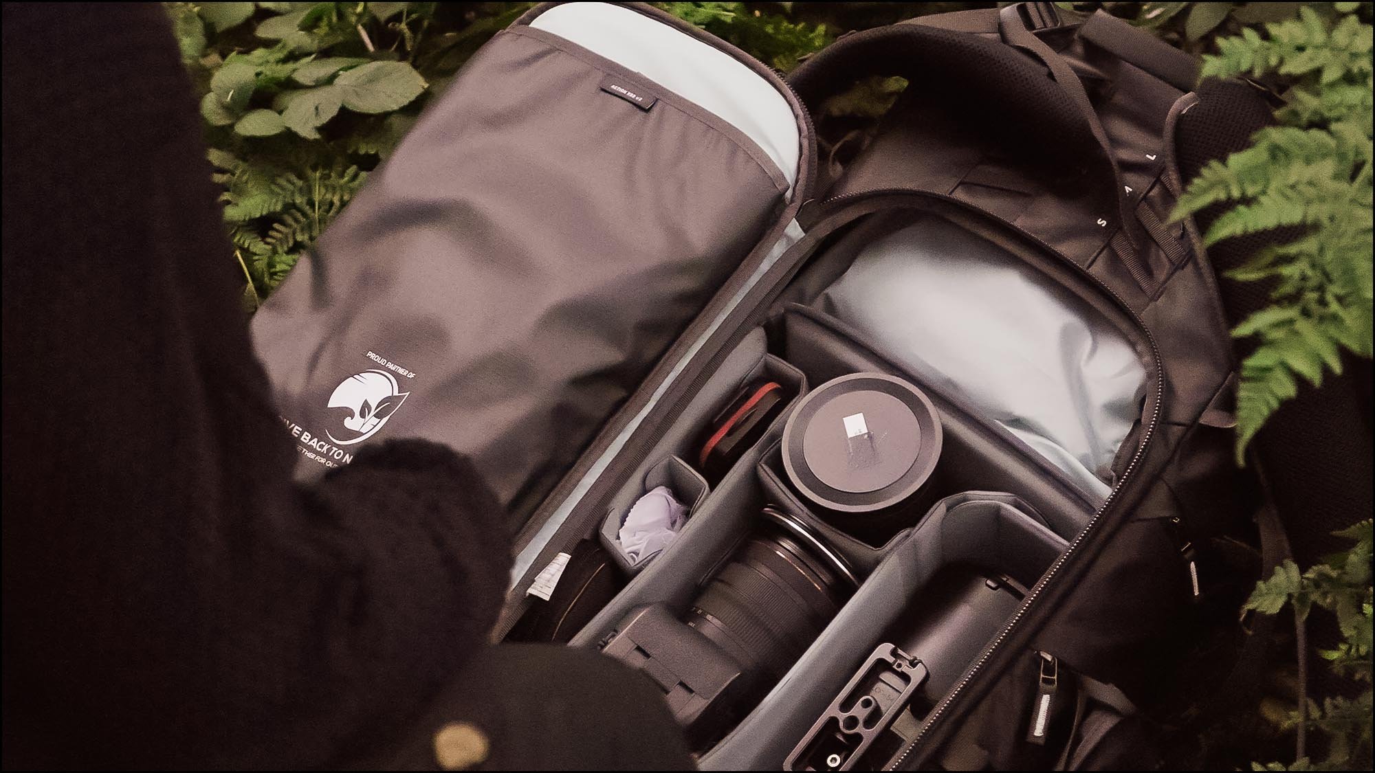 Camera bag open with cameras and lenses