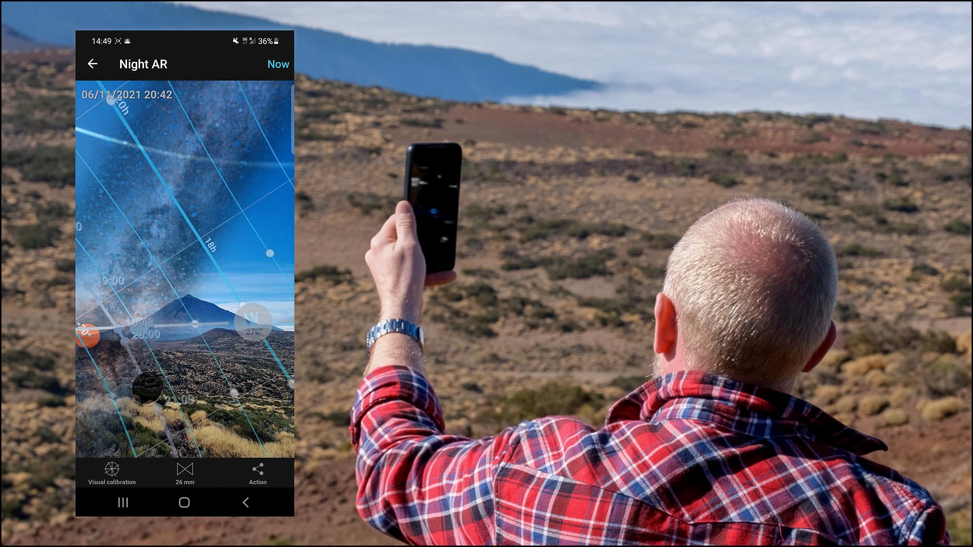 Man using phone app to find the Milky Way