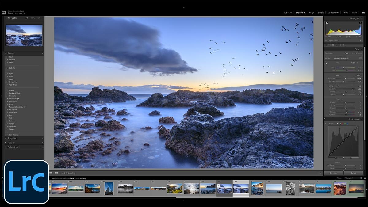 Adobe Lightroom screenshot showing a rocky coastline photo at sunset with birds.