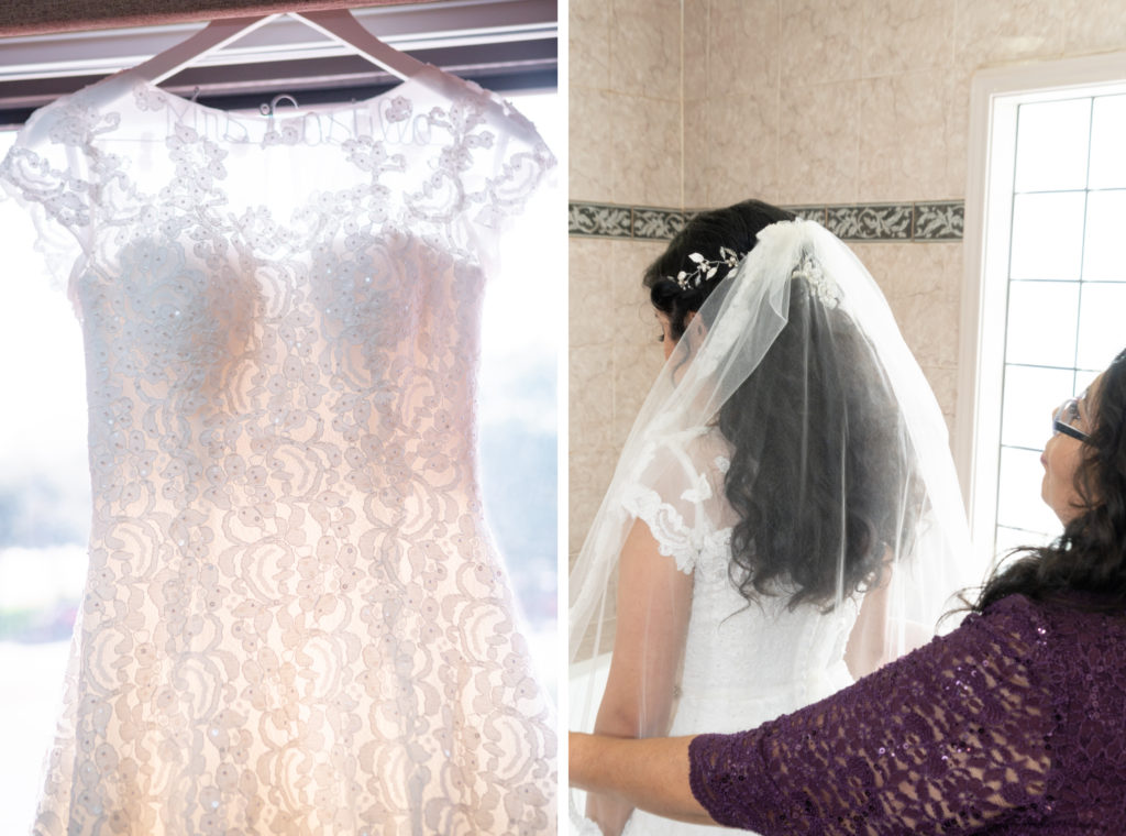 Bride's dress hanging in window on left. Bride facing wall with her mom holding her veil.