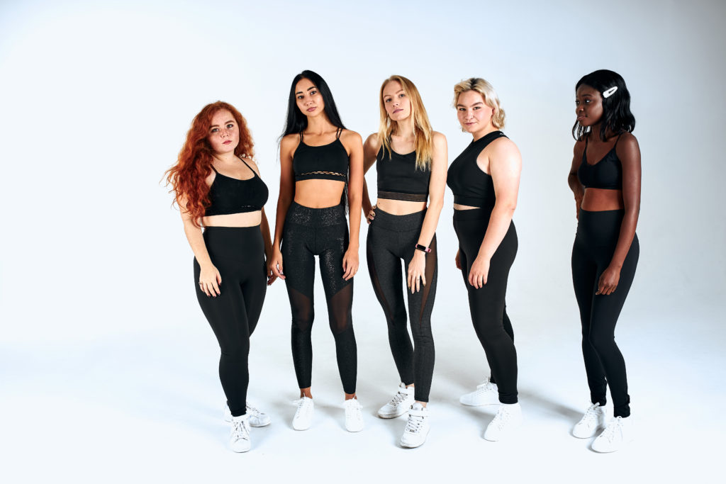 Mixed interracial women in tights of different sizes.
